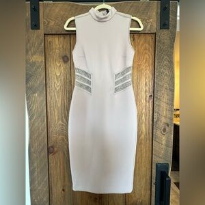 Marciano form fitting, shin length dress.